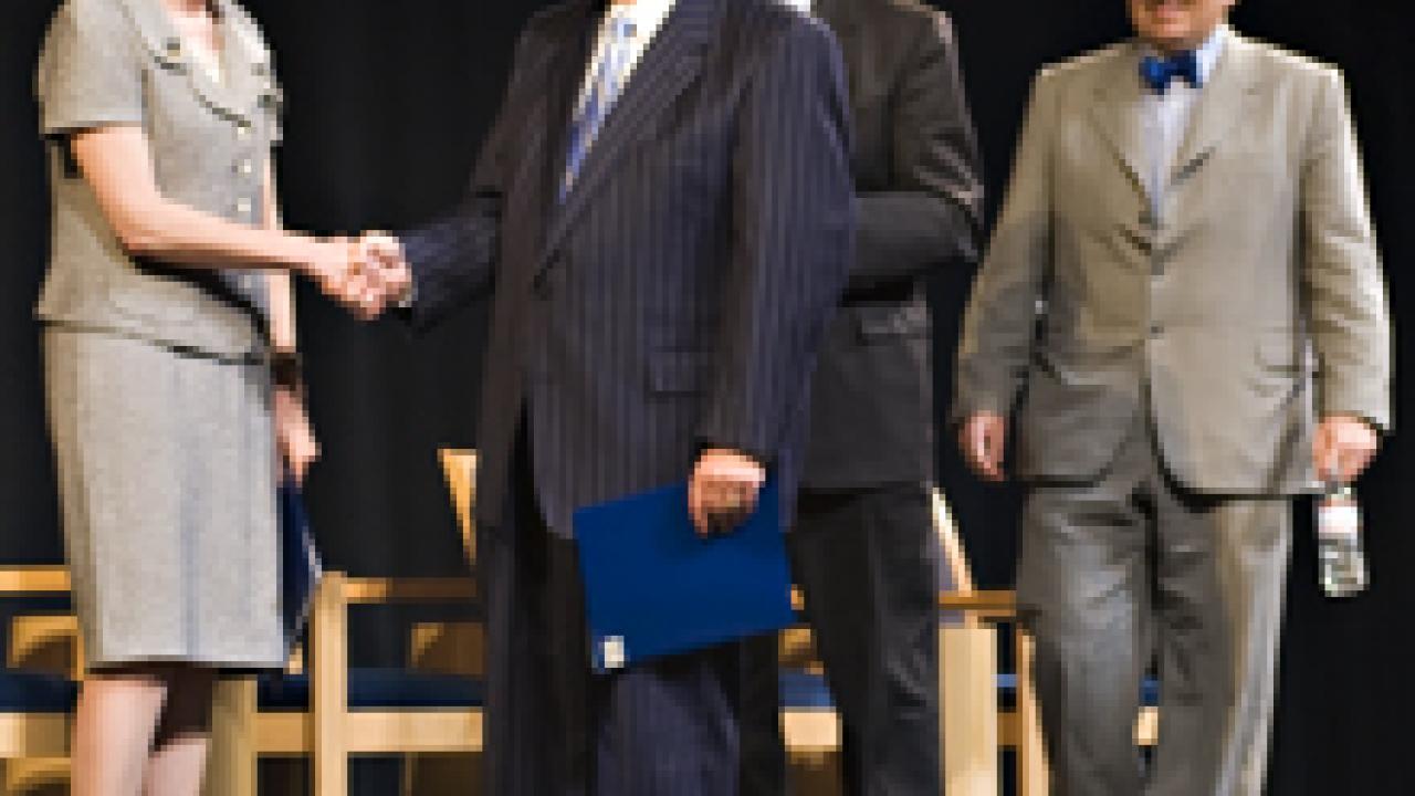 The chancellor-designate is pictured on the Jackson Hall stage with, from left, UC President Mark G. Yudof, Regent Russell Gould and Professor Bob Powell, chair of the Academic Senate.