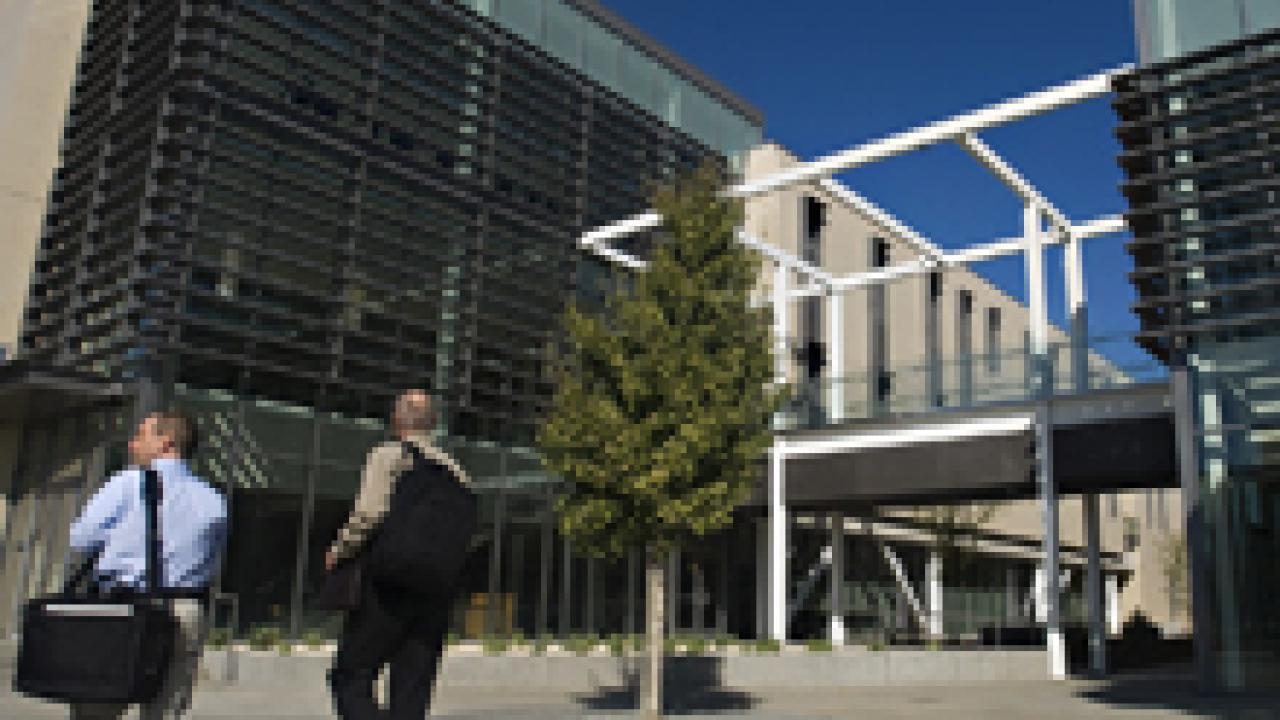 Students walk outside Maurice J. Gallagher Jr. Hall, the new home of the Graduate School of Management, on Oct. 5.