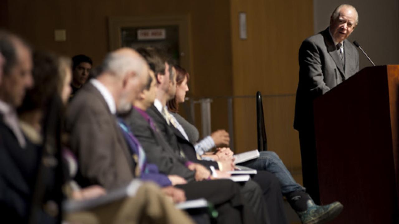 Photo: Cruz Reynoso turns to fellow task force members at April 11 forum.