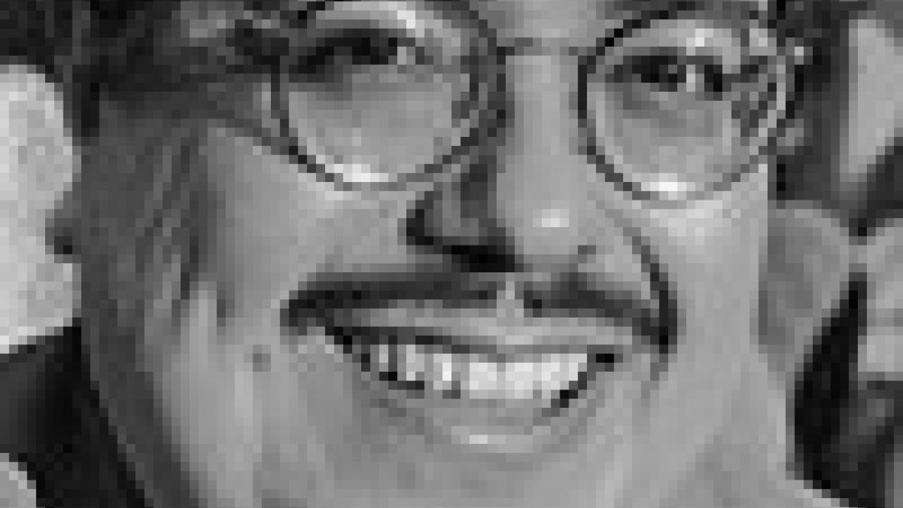 Photo: black and white portrait of Francisco Alarcon