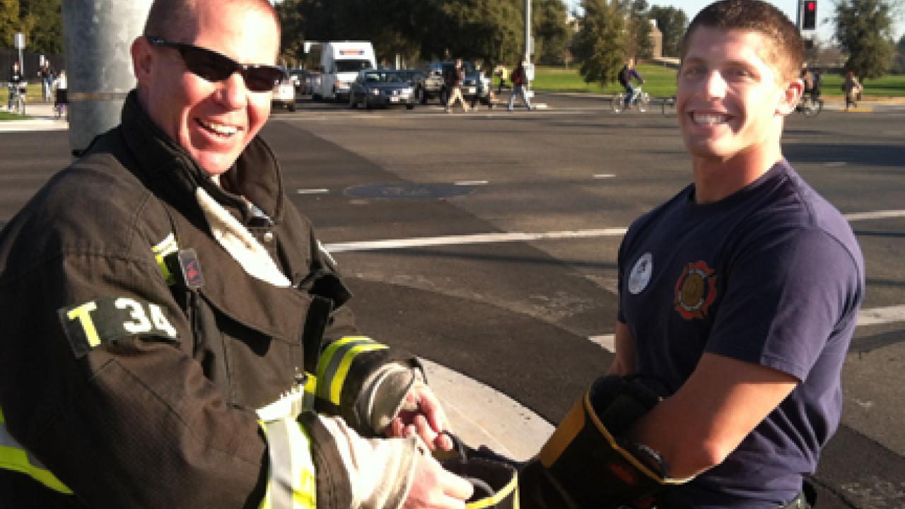 Photo: UC Davis firefighters Shawn Cullen and Kyle Dubs are all smiles at the successful Fill the Boot for Burns fundraiser Feb. 17.
