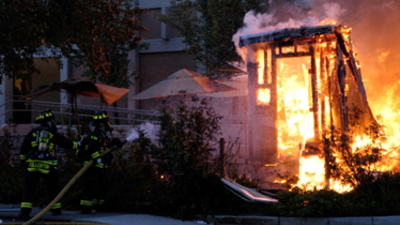 Firefighters battle Cargo Coffee hut fire outside King Hall