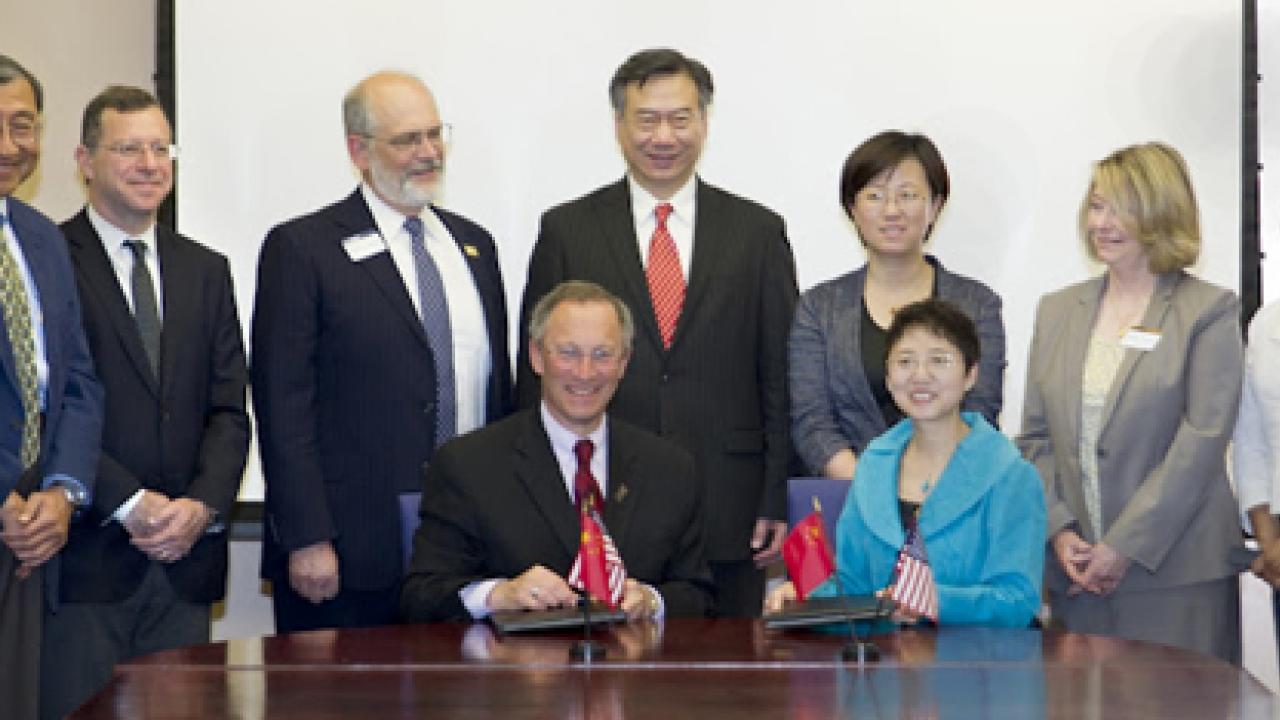 Photo: Signing ceremony, with Ralph J. Hexter, Liu Jinghui and others