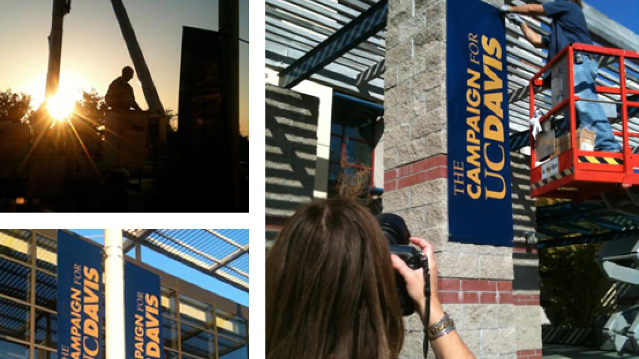 Photos (3): Worker in a cherry picker raises a new banner; two of the banners in place; and a news photographer shooting a banner installation.
