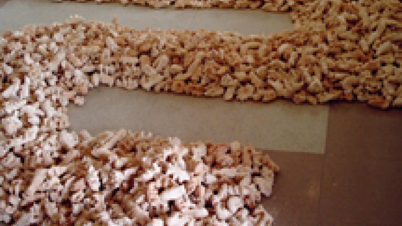 ... and Maisee Lor's clay path artwork is on the floor at the Craft Center Gallery.