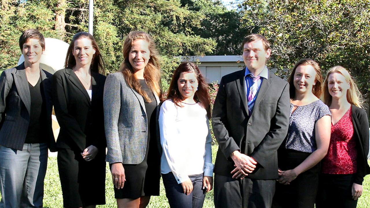 Photo: Six ELIPPS CA Fellows and the ELIPPS director, in a line, posed, in front of Mrak Hall