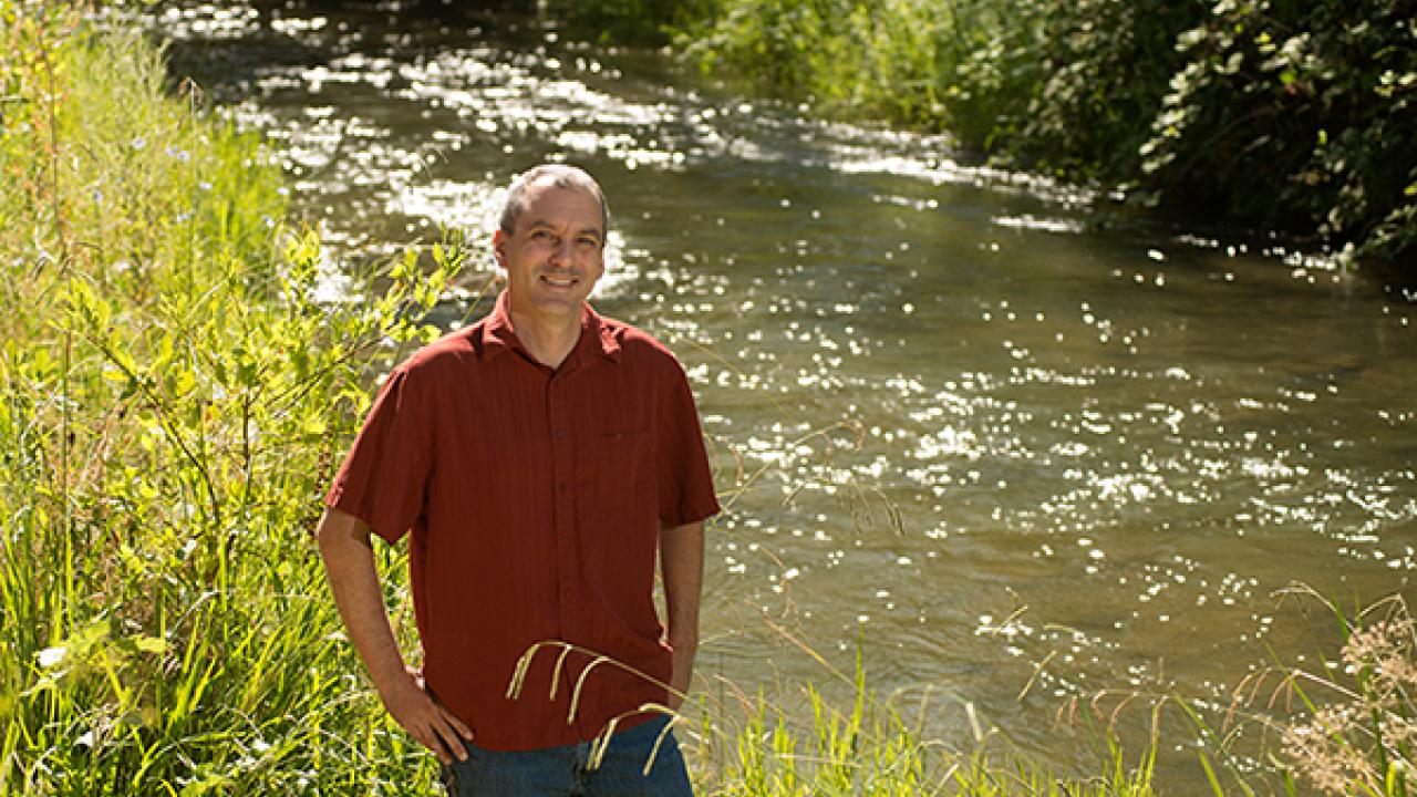 Photo: Andrew Fulks along Putah Creek in the UC Davis Putah Creek Riparian reserve