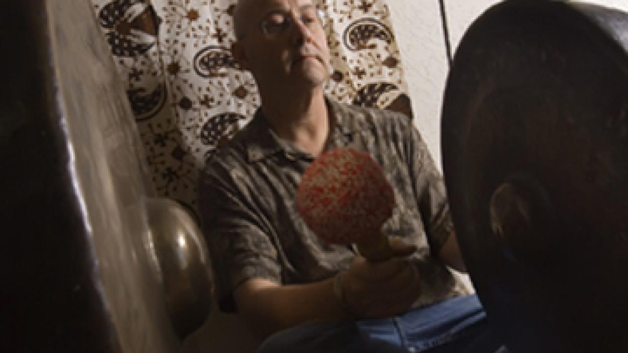 Assistant Professor Henry Spiller, director of UC Davis' new Gamelan Ensemble, plays the gong.
