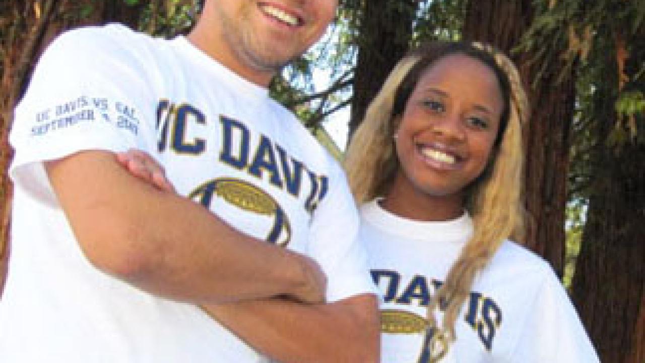 Photo: Students and bookstore employees Sam Gozun and Chynne Pharr model the football shirts with sleeve lettering that notes the Sept. 4 game.
