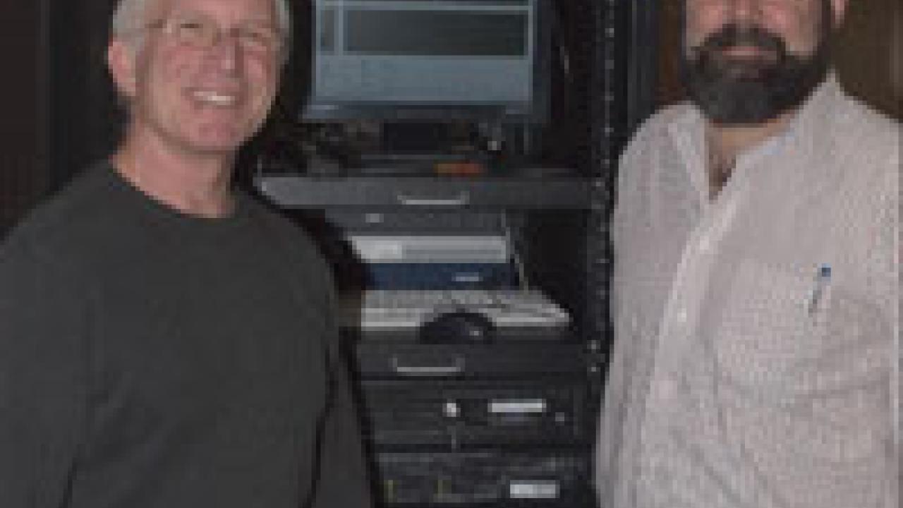 From left, Mike McCoy and Jim Quinn flank a rack that hosts a few of the 22 servers that maintain a world of data at ICE. &ldquo;It has been a treat to help launch a tech-savvy generation of environmental problem-solvers,&rdquo; Quinn says. For details 