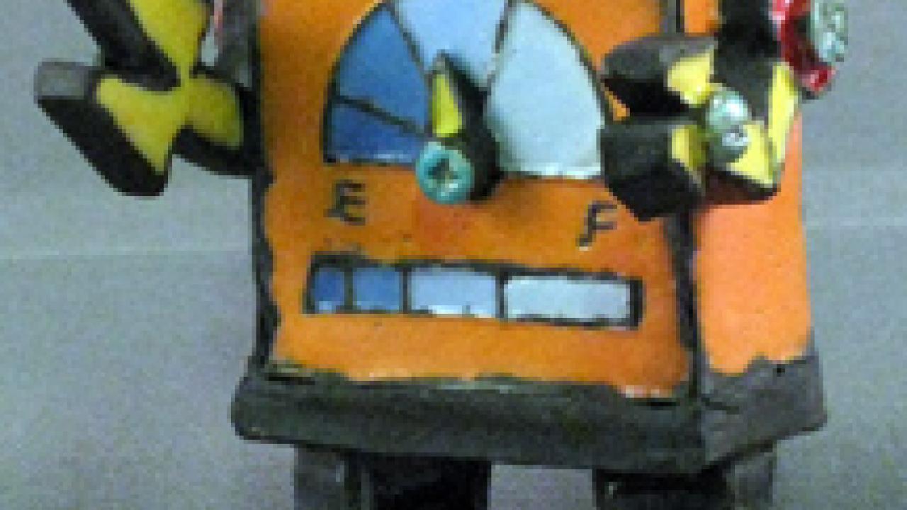 A raku-fired ceramic robot by Kasha Maslowski, from her show titled Whilst Dreaming I at the Craft Center Gallery.