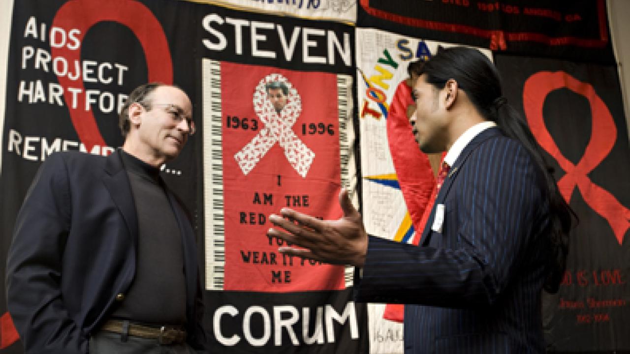 Against the backdrop of the AIDS Memorial Quilt, author Tracy Kidder chats with Mikael Villalobos, book project coordinator, on World AIDS Day.