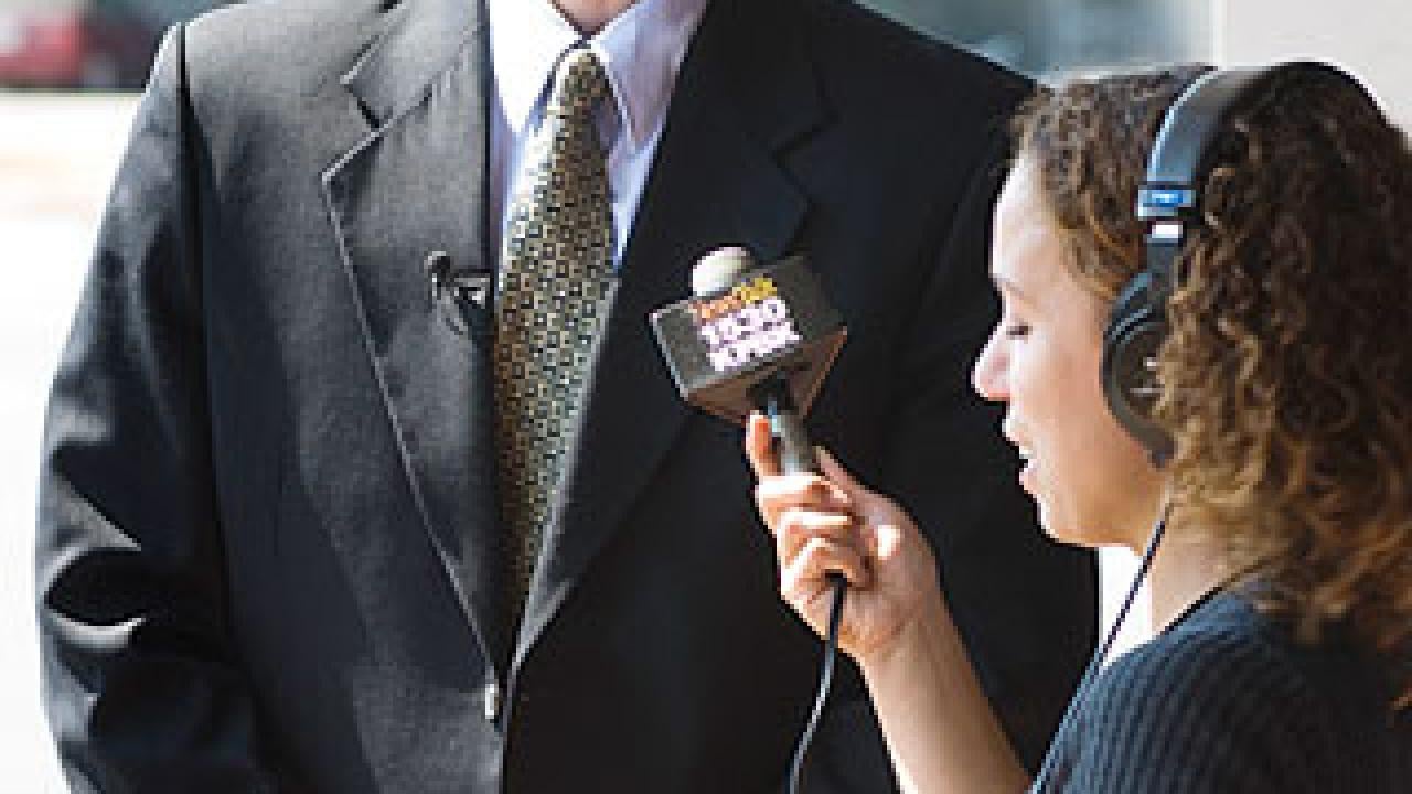 Photo: Michael Kleeman talking to reporter Nikki Modero