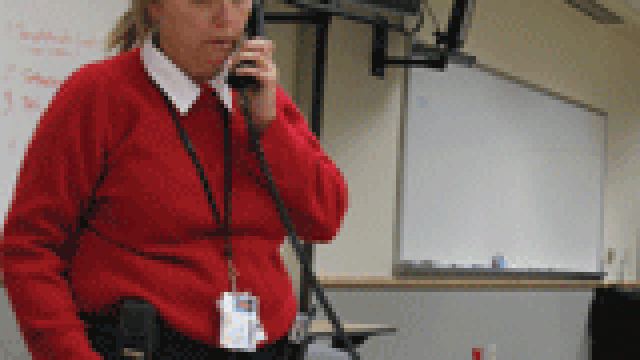 UC Davis Emergency Manager Valerie Lucus confers with other officials during the Jan. 4 windstorm. She is pictured at the campus&rsquo;s Emergency Operations Center, which is equipped with telephones and computer connections, along with televisions 