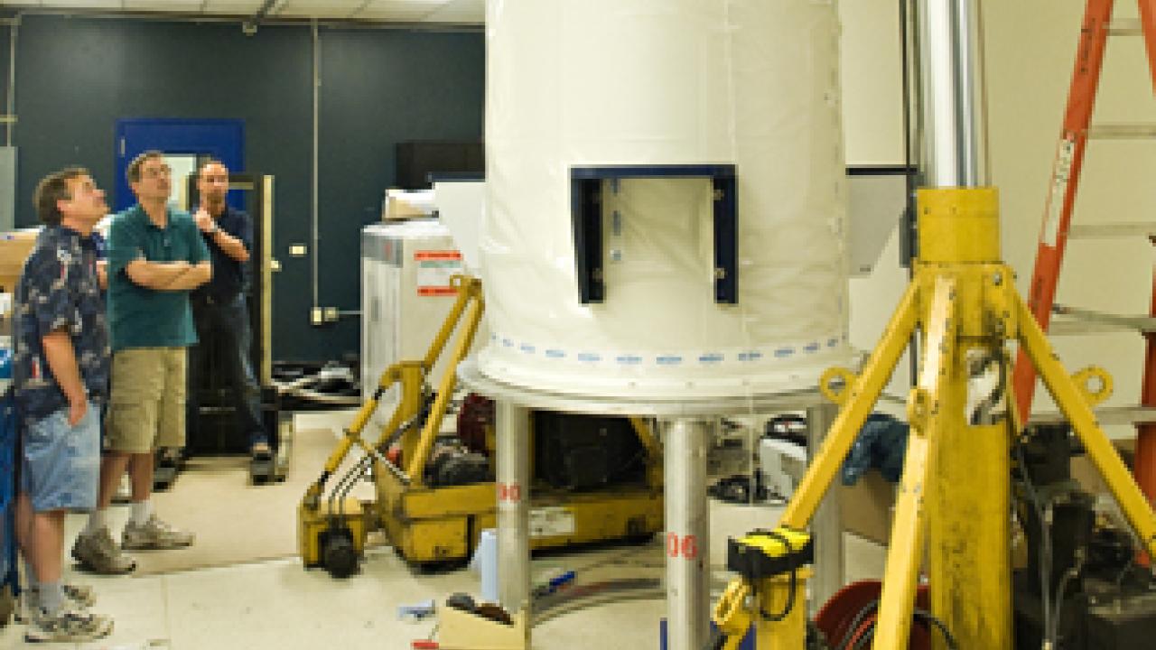 Jeff Walton, Jeff de Ropp and an unidentified Bruker Biospin employee check on the installation progress.