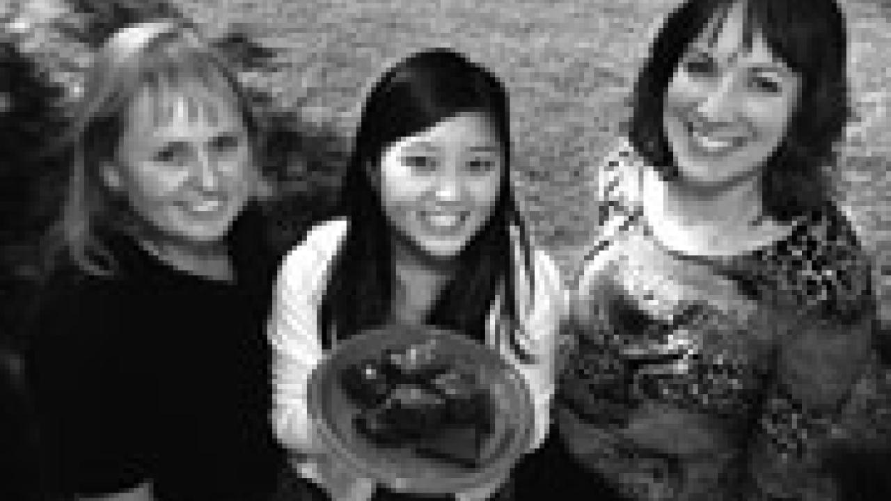 Davis neighbors are invited to get to know one another at Davis Neighbors&rsquo; Night Out on Oct. 6. From left to right are Anne Brunette of the city, third-year student Adrienne Cheung and Michelle Johnston of Health Education and Promotion on cam