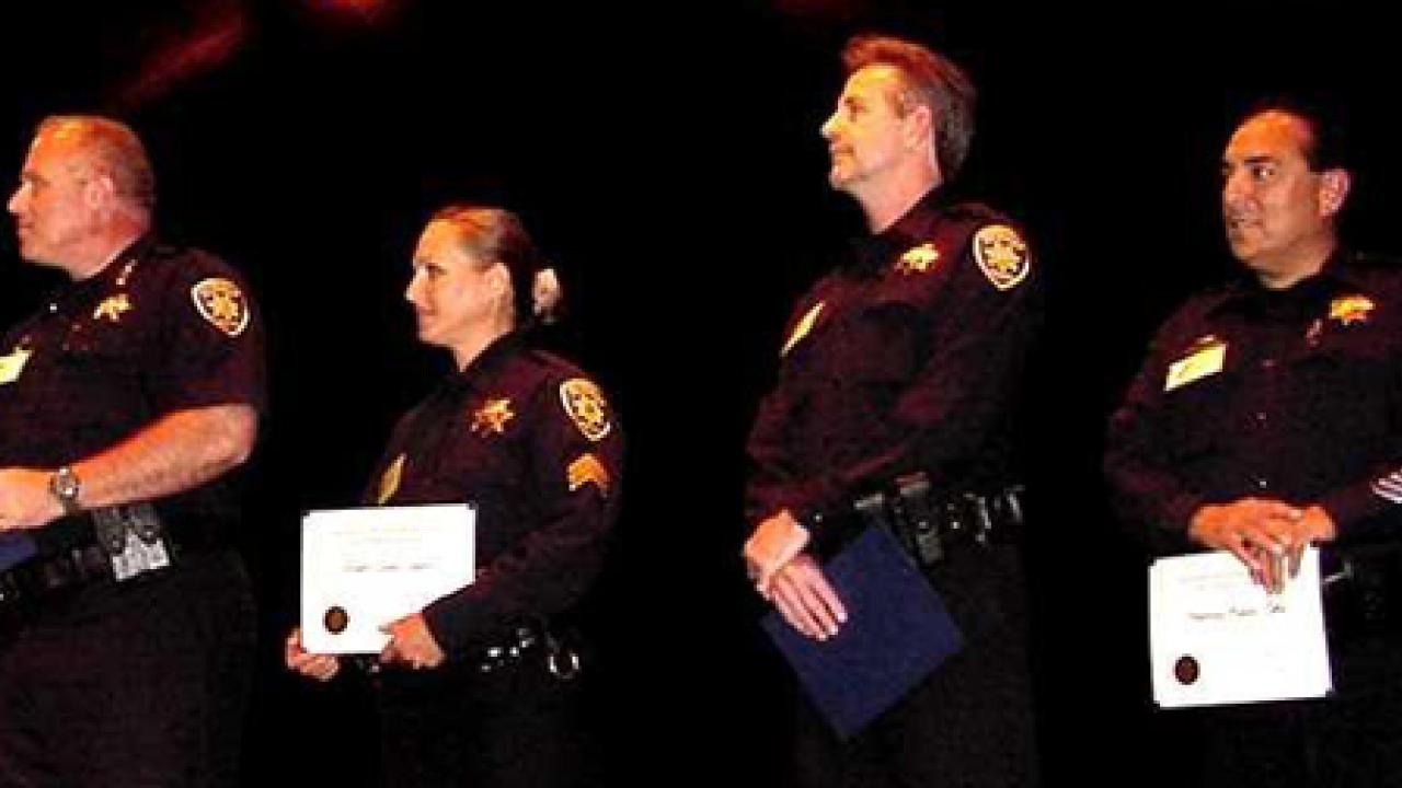 Photo: Handy Leadership Award recipients Chief Matt Carmichael, Sgt. Jennifer Garcia, and officers Raymond Holguin and Timothy Hunter