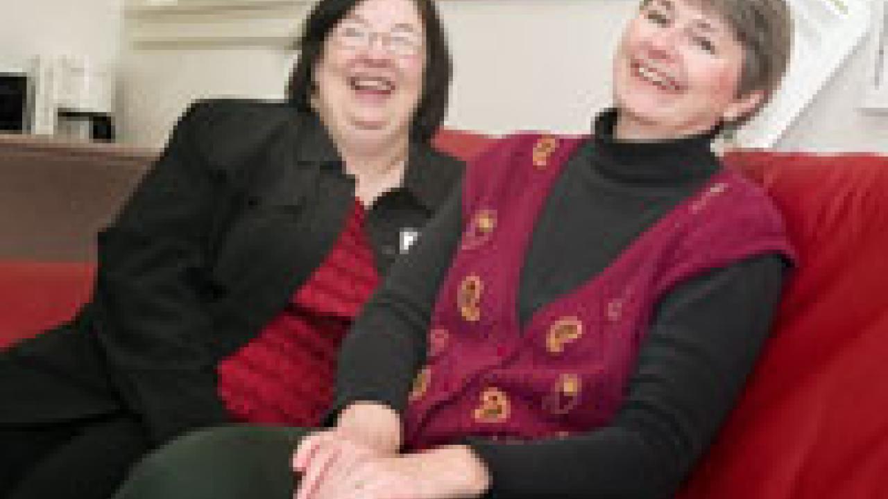 Shirley Sperry, left, and Karen Faithorn share a couch in the Re-entry Student Services lounge. Sperry is the coordinator for the Re-entry Student Services unit, and Faithorn is a former re-entry student who works at the Cowell Student Health Ce