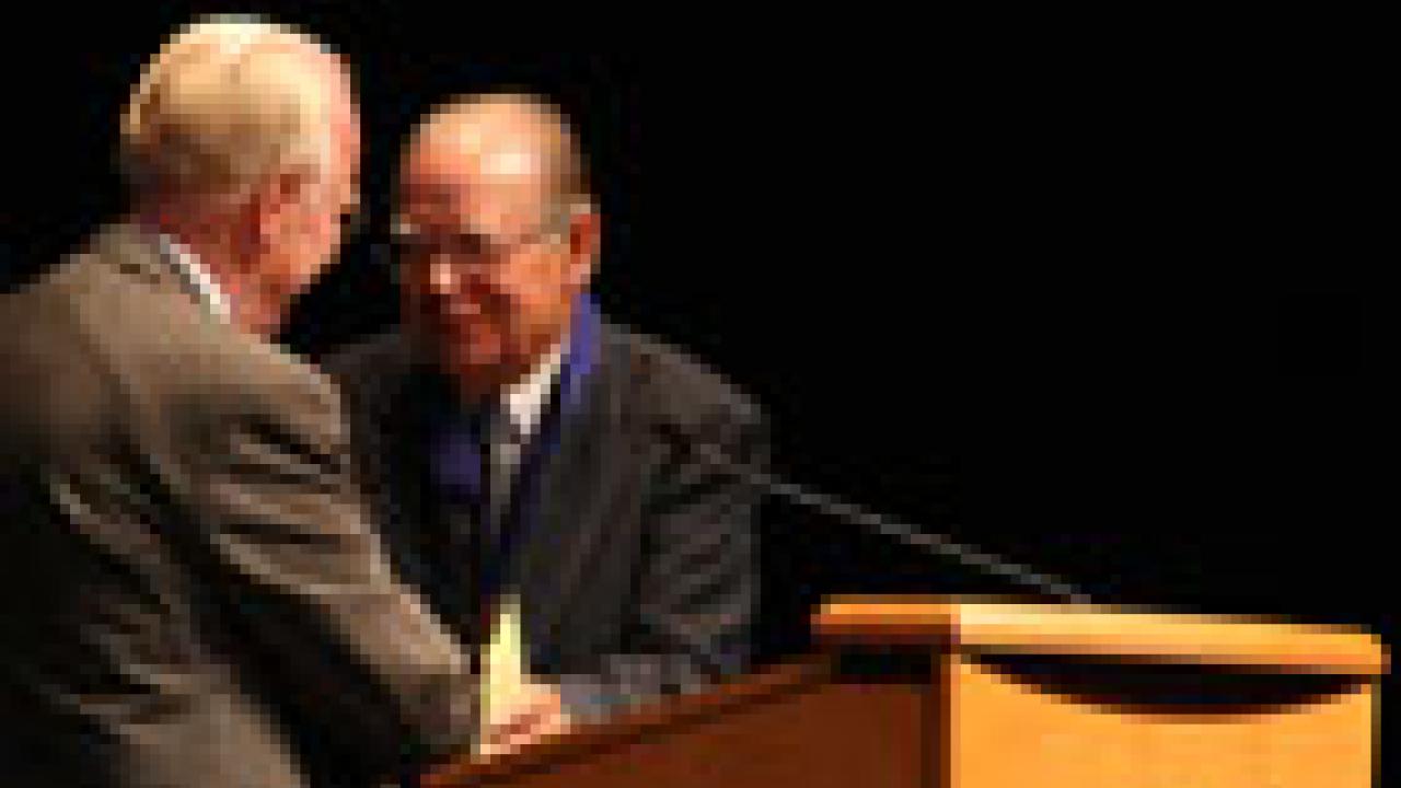 Chancellor Larry Vanderhoef, left, congratulates Cruz Reynoso at the Sept. 15 ceremony honoring the law professor.