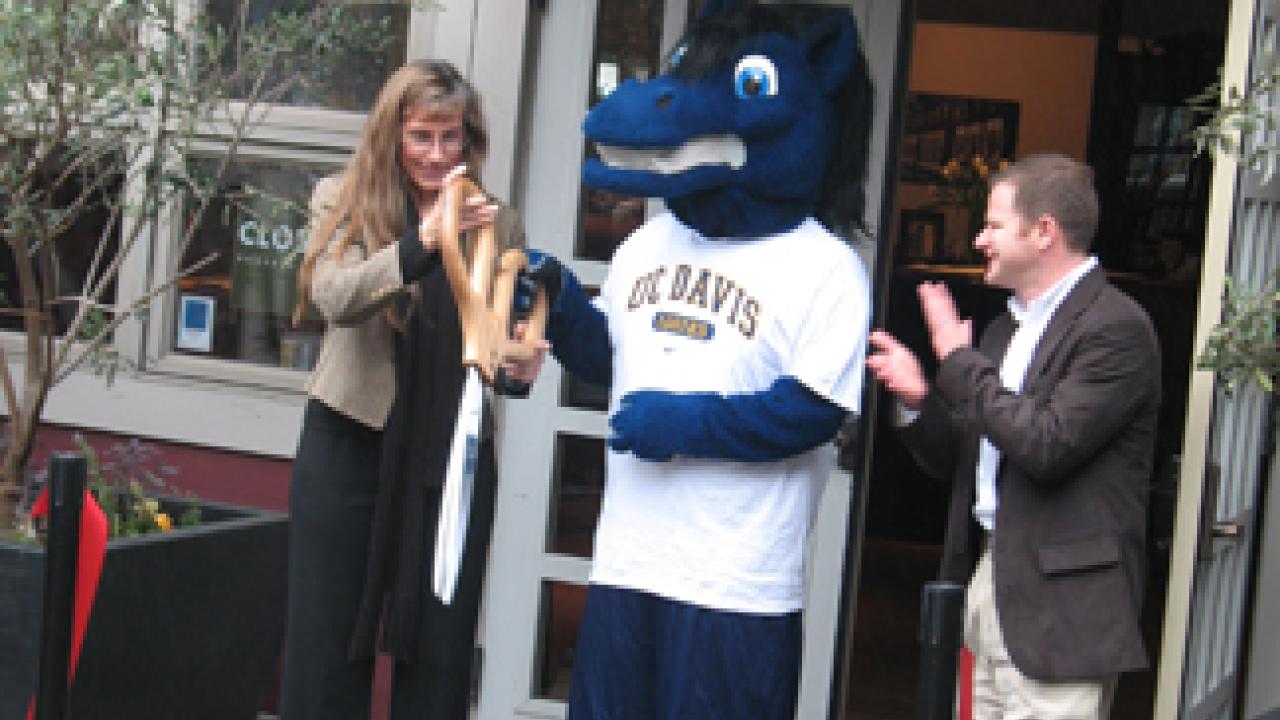Aggie mascot Gunrock, Gina Rios of Sodexo and Brett Burns, director of Memorial Union Auxiliary Services, at the Gunrock Pub ribbon-cutting on Jan. 5.