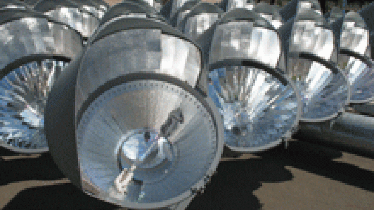 Photo shows part of one of the banks of lights, prior to
being hoisted into place. A Musco Lighting spokesman said the reflectors
within each fixture are customized for that light, ensuring that the beam
goes &ldquo;where we want it go.&rdquo; The re