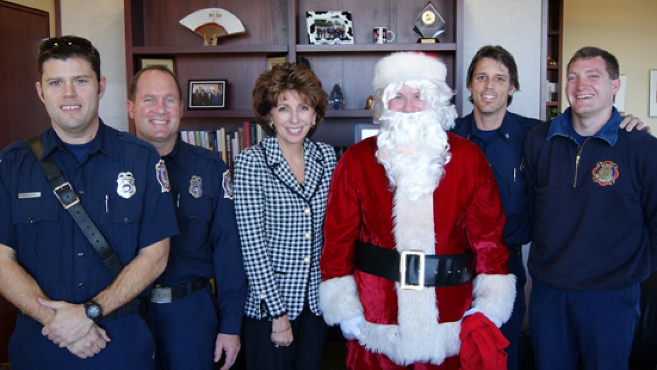 Photo: Firefighters Tait Nilsson, Joe Newman, Derek Carthy, Paul Fullerton and Jon Poganski, with Chancellor Linda P.B. Katehi