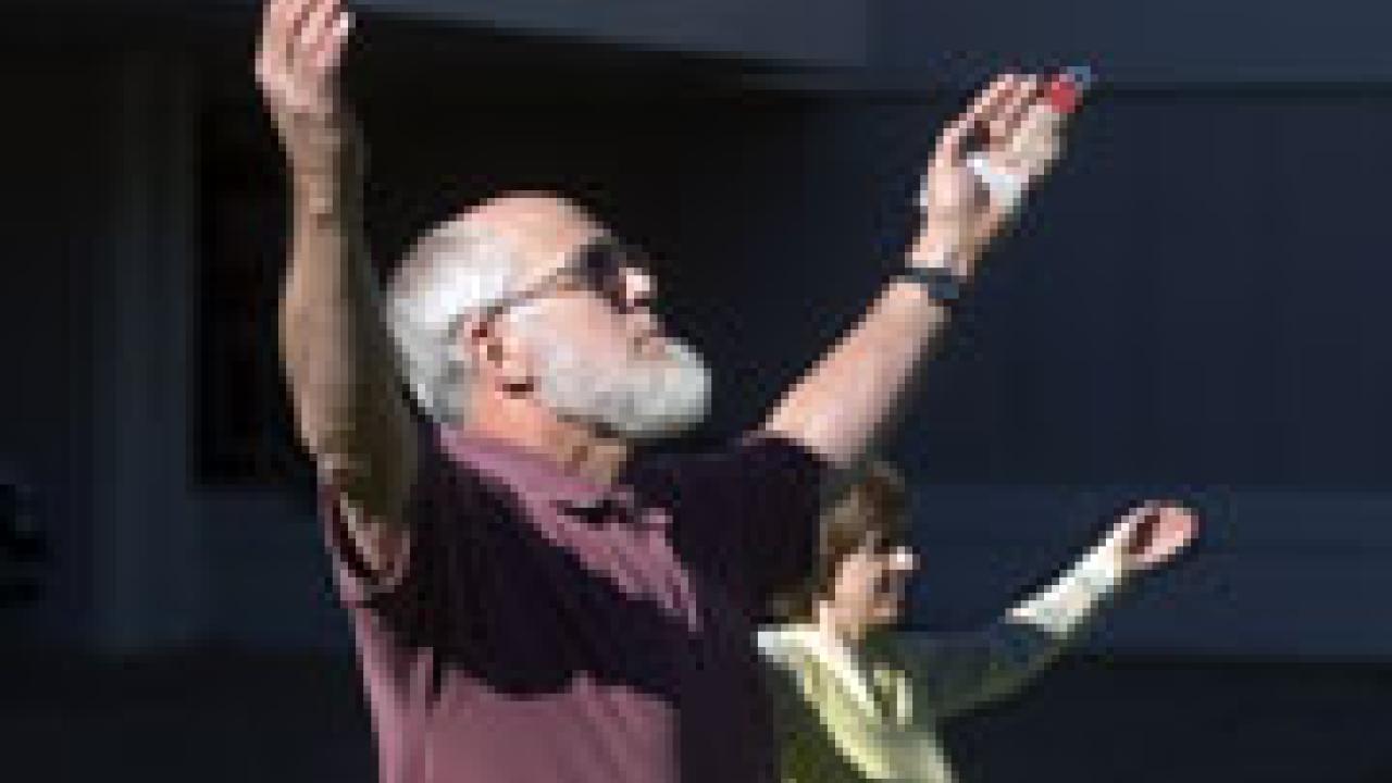 John Neil, left, and post-doctoral scholar Olga Trofymluke perform Tai Chi excercises outside the Chemistry Annex. 