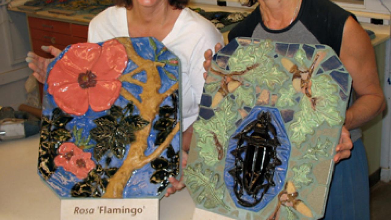 Diane Ullman and Donna Billick, with some of the tiles that the women crafted for Nature's Gallery.