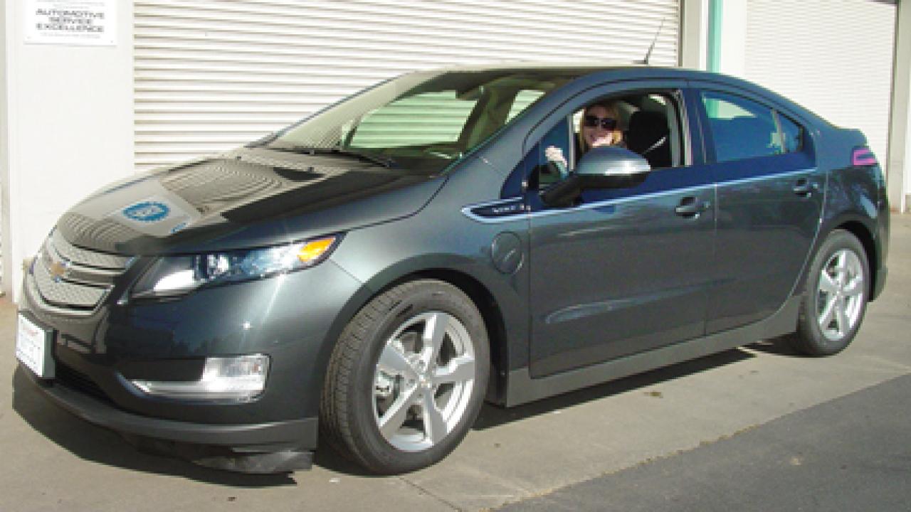 Photo: Fleet Services employee Casey Hendrickson in the driver's seat of UC Davis' new Chevrolet Volt