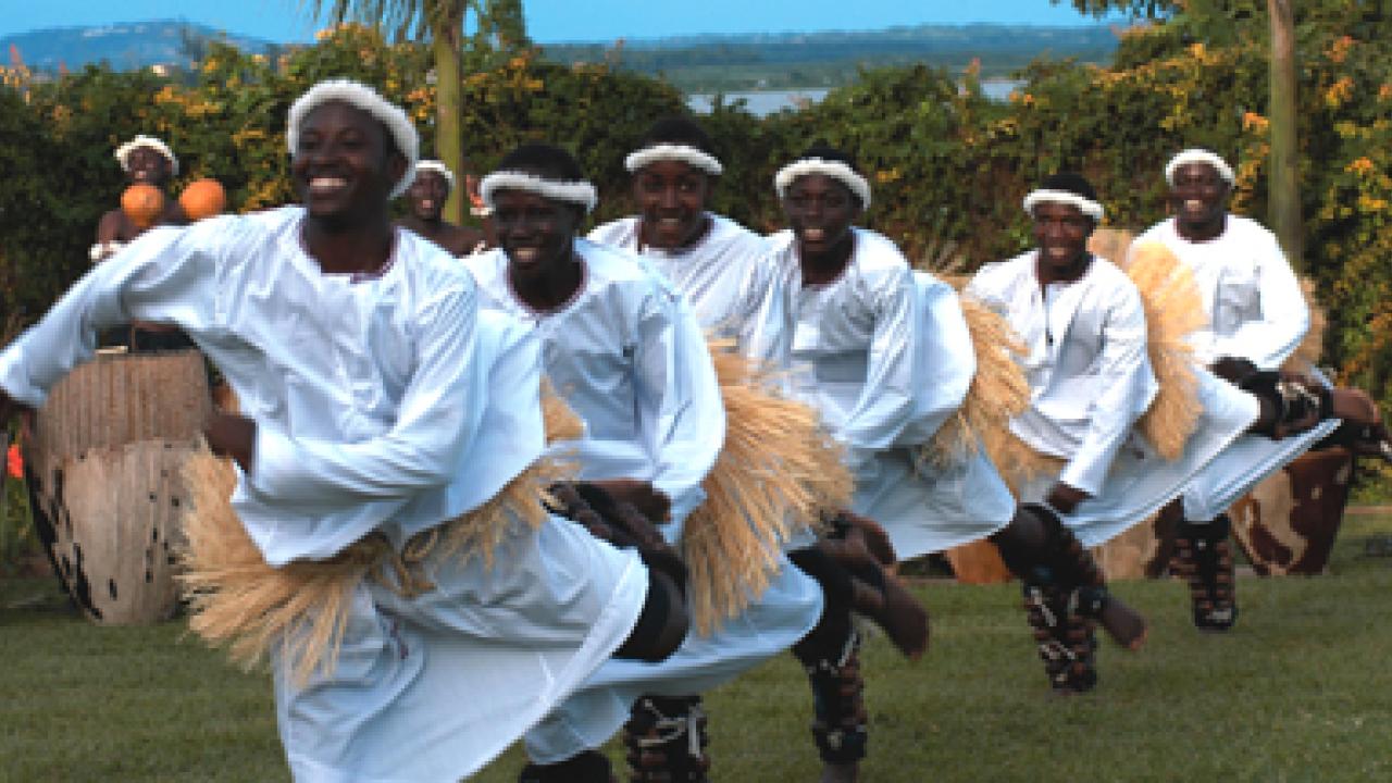 Spirit of Uganda uses drums and other percussion instruments, stirring call-and-response vocals, vibrant and colorful costumes, and dramatic choreogra