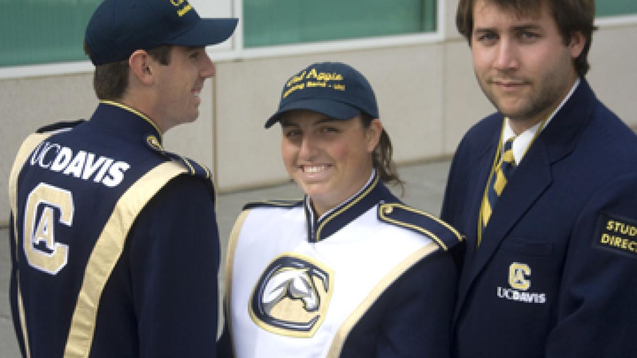 Band members Arbel Bedak, left, and Susanna Peeples in new uniforms, and Olin Hannum in student director's blazer.