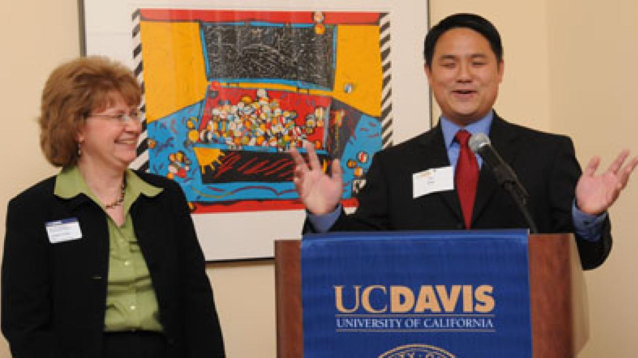 Louise Uota listens to accolades from Staff Assembly Chair Lin King, thanking Uota for her work as manager of the chancellor&rsquo;s residence.