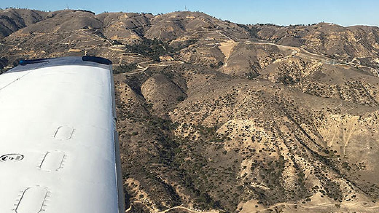 Aerial view of Southern California hills with sky in background