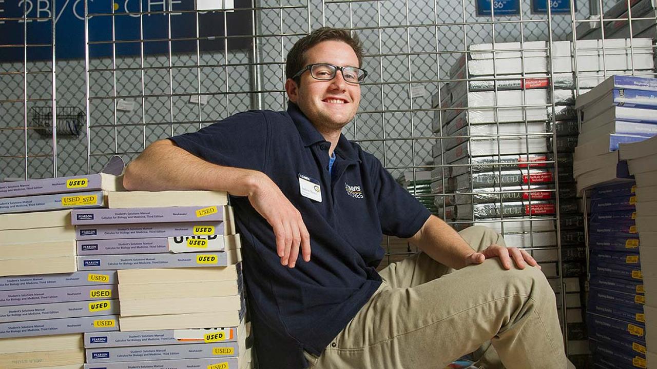 Andrew Musca in piles of textbooks