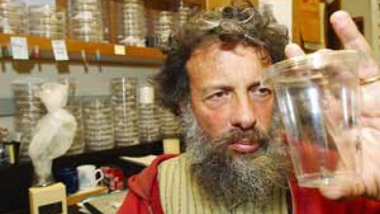 Photo: Man staring into cup