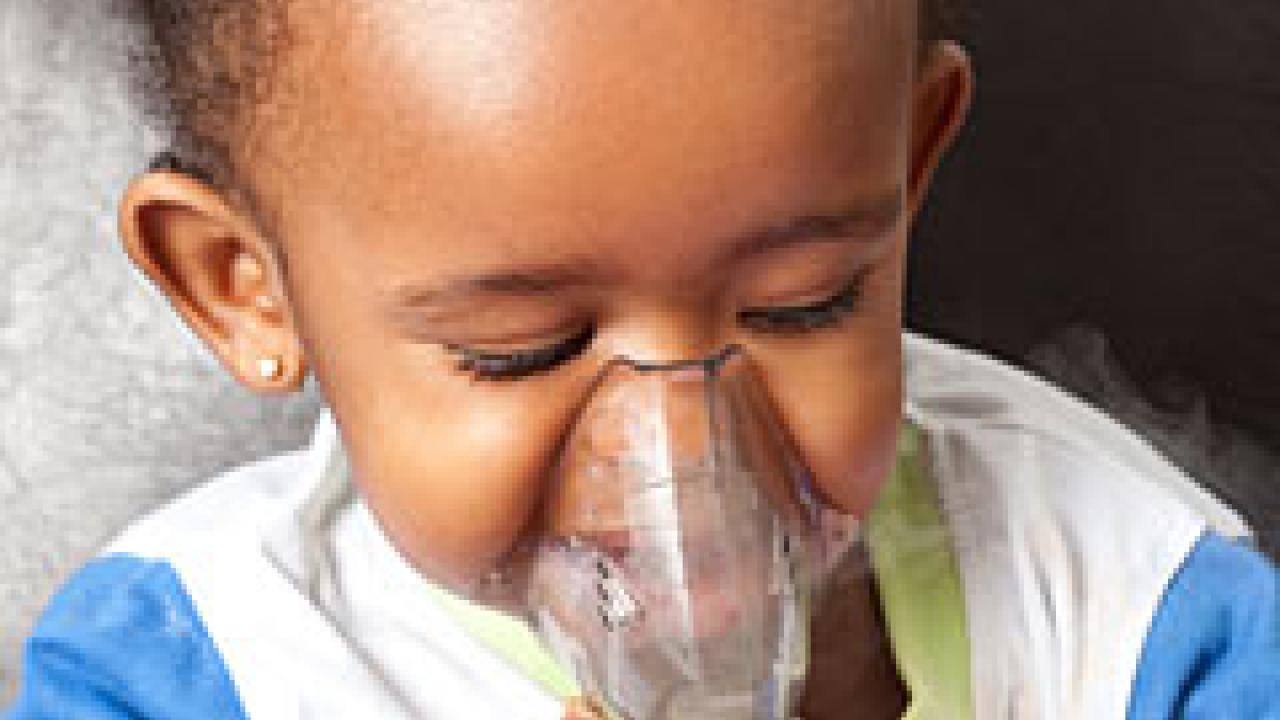 Photo: baby breathing into a device