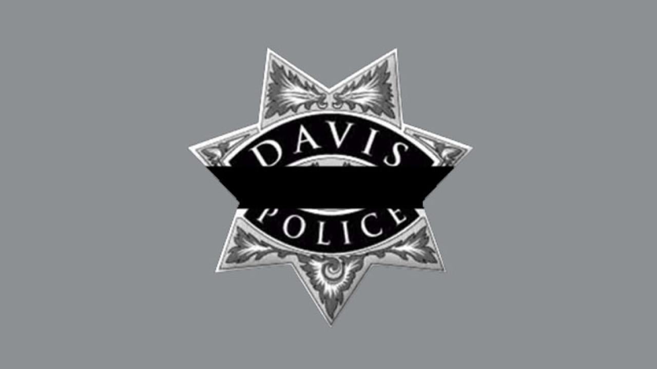 Davis police badge with mourning band