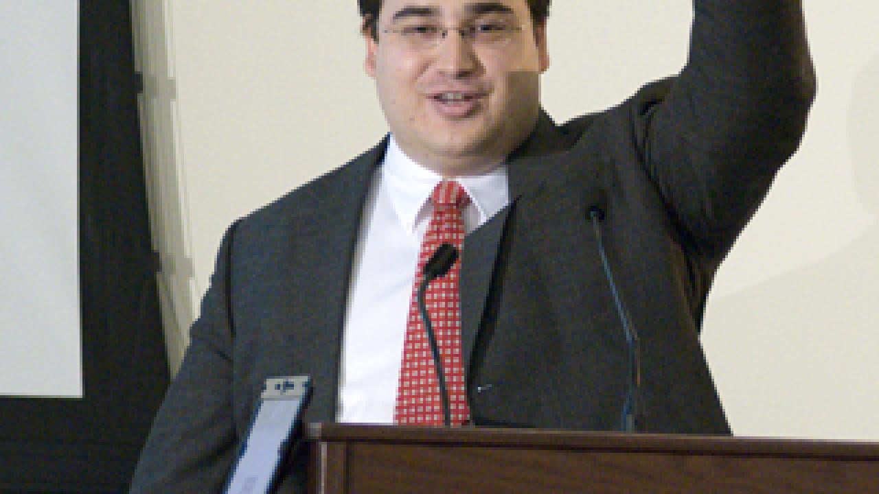 John-Paul Farsight, an MBA student, holds up a fuel cell at annual Big Bang Business Plan Competition. His ECO Catalytics team won second-place and the People's Choice Award for developing a technology that reduces the amount of expensive platin