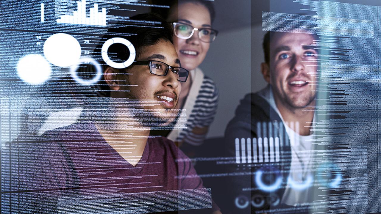 People look at statistics on a glass display