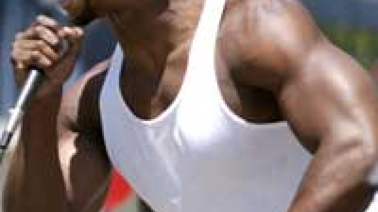 Photo: man singing into a microphone