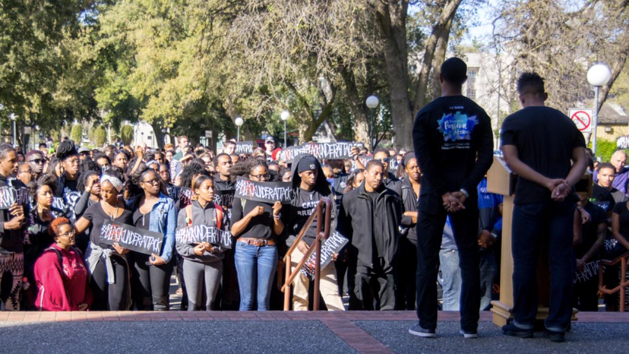 Photo: Students address #blackunderattack demonstration at north steps of Mrak Hall.
