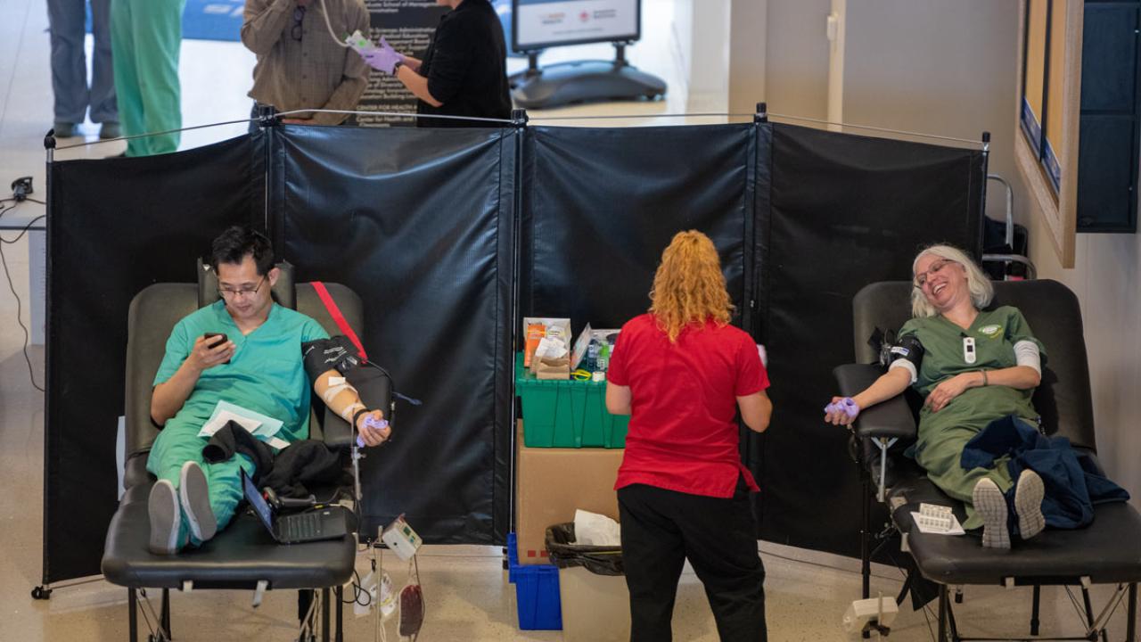 Two donors, 6 feet apart, at blood drive