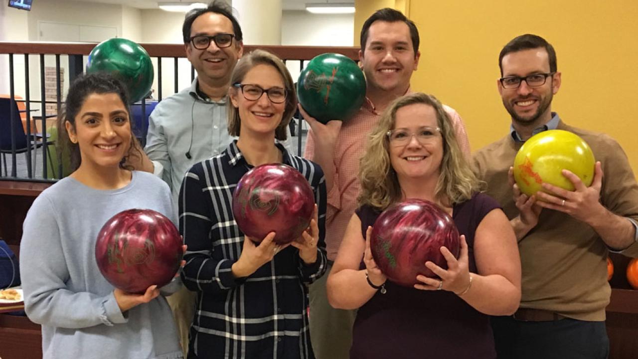 Six bowlers, group photo, holding bowling balls