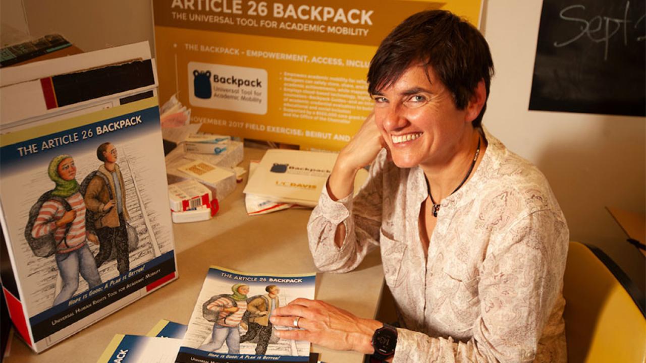 A woman with the Article 26 Backpack comic book