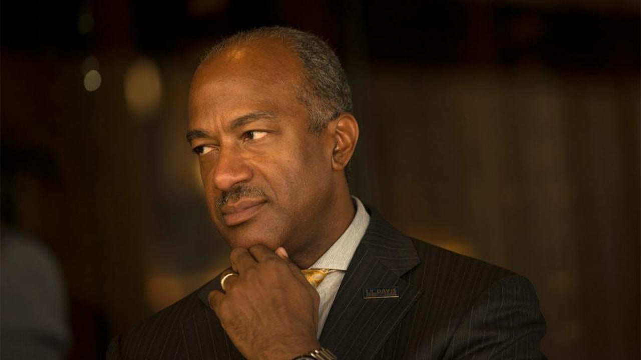 Chancellor Gary S. May looks to the left.