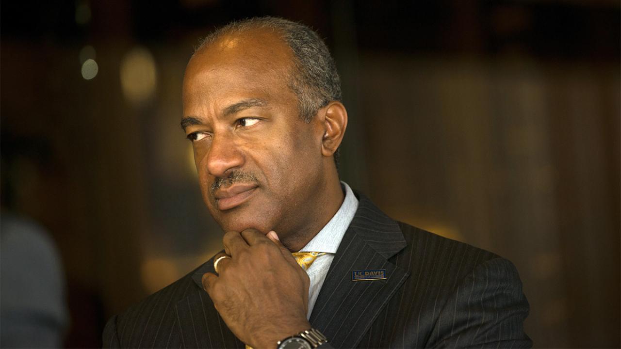 Chancellor Gary S. May looks to the left.