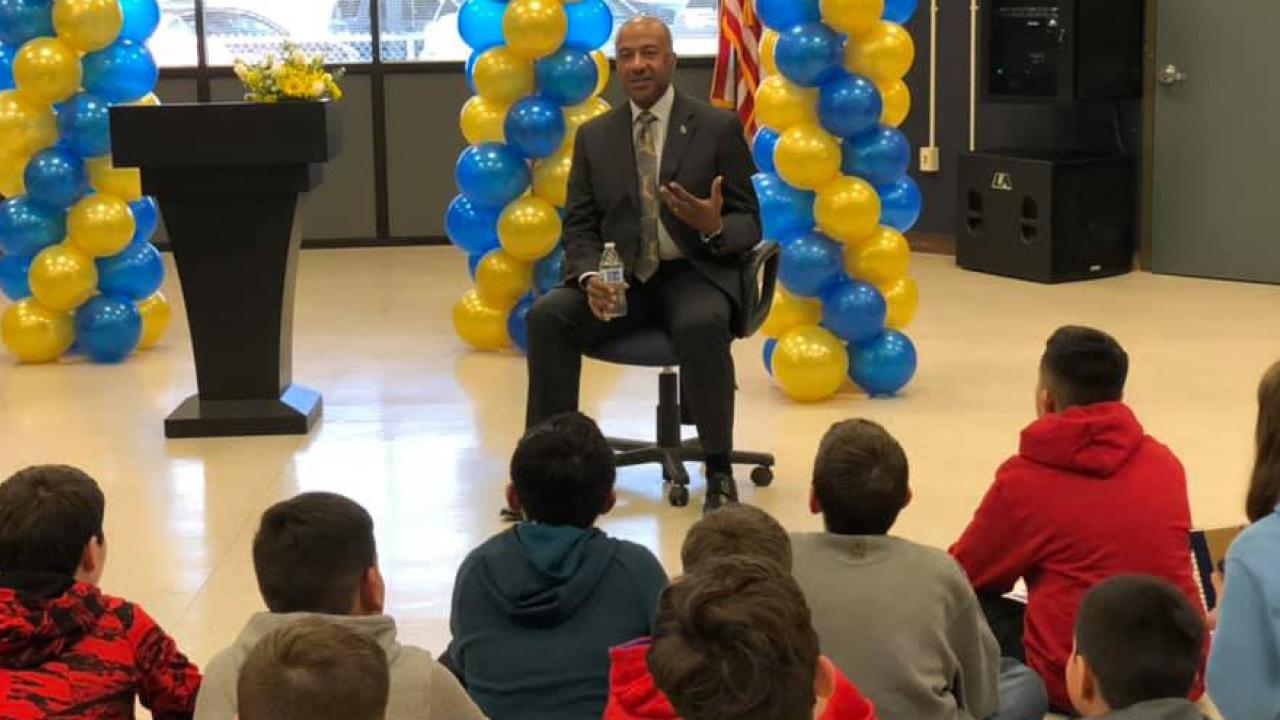 Chancellor Gary S. May speaks to elementary school students.