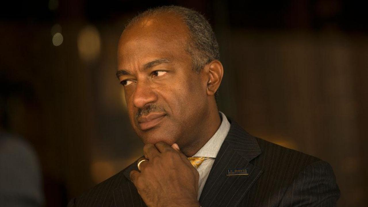 Chancellor Gary S. May, chin in hand