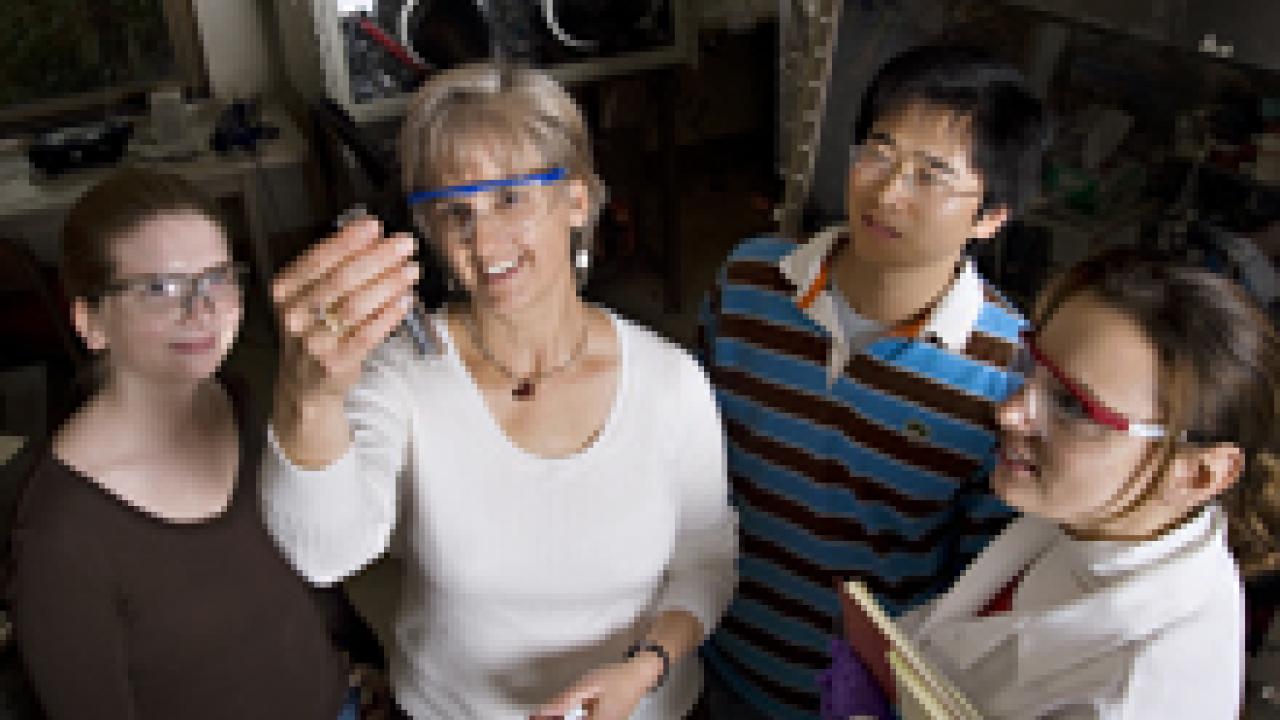 Chemistry professor Susan Kauzlarich, second from left, works with students in her campus laboratory. 