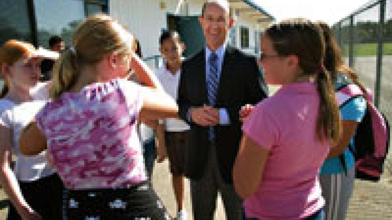 Harold Levine, dean of the School of Education, talks with students from the West Sacramento Early College Prep Charter School on the first day of classes Aug. 22.